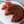 Laden Sie das Bild in den Galerie-Viewer, STEINER´s Schokokuchen auf einer weißen runden Marmorplatte. Der Kuchen ist angeschnitten und daneben liegen zwei Erdbeeren.
