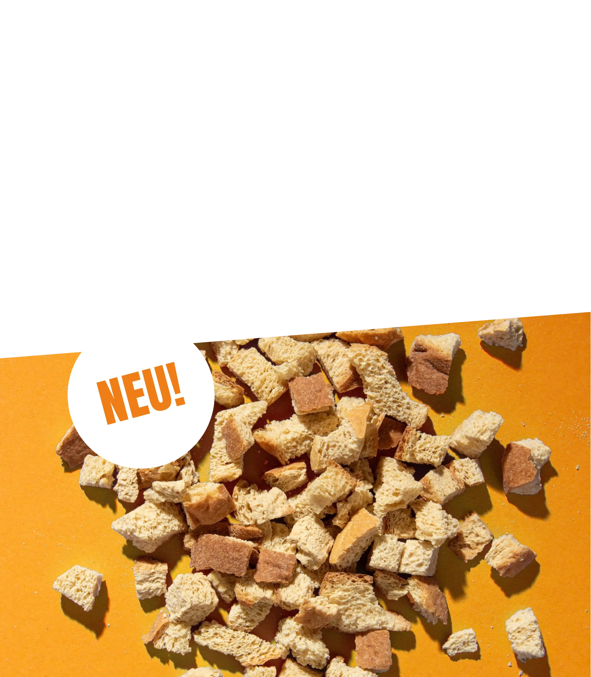 STEINER´s Low Carb High Protein Croutons auf orangenem Untergrund.